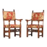 A PAIR OF ITALIAN CARVED WALNUT AND UPHOLSTERED ARMCHAIRS IN RENAISSANCE TASTE