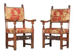A PAIR OF ITALIAN CARVED WALNUT AND UPHOLSTERED ARMCHAIRS IN RENAISSANCE TASTE
