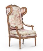 A GREY PAINTED BEECH WING OPEN ARMCHAIR IN LOUIS XVI STYLE