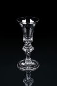 A HEAVY BALUSTER WINE GLASS