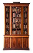 Y A REGENCY MAHOGANY AND SATINWOOD BOOKCASE