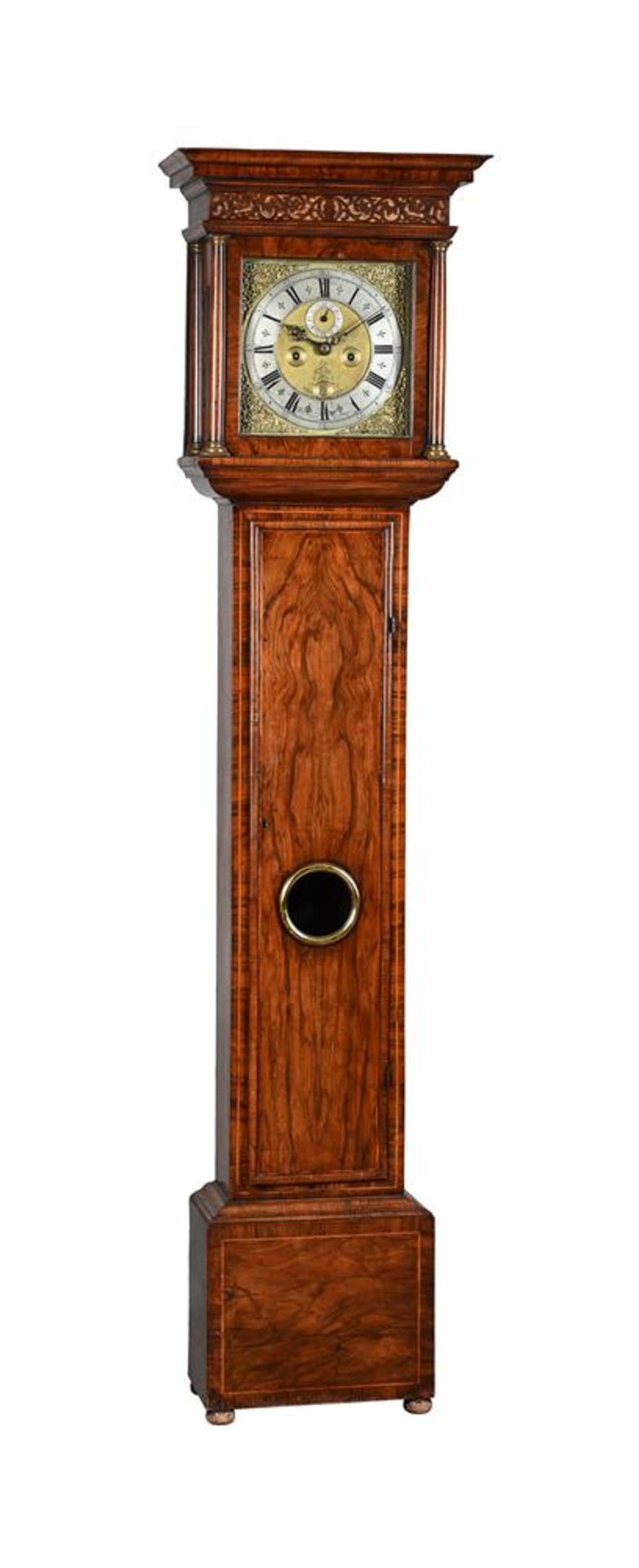 A WALNUT EIGHT-DAY LONGCASE CLOCK WITH AN ELEVEN-INCH DIAL