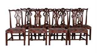 A SET OF TWENTY-FOUR MAHOGANY DINING CHAIRS IN GEORGE III STYLE