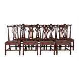 A SET OF TWENTY-FOUR MAHOGANY DINING CHAIRS IN GEORGE III STYLE