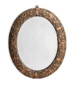 A CARVED GILT GESSO AND COMPOSITION OVAL MIRROR, IN LOUIS XIV STYLE