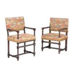 A NEAR PAIR OF CARVED OAK AND TAPESTRY UPHOLSTERED ARMCHAIRS