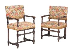 A NEAR PAIR OF CARVED OAK AND TAPESTRY UPHOLSTERED ARMCHAIRS