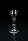 A BALUSTER WINE GLASSCIRCA 1730The bell bowl with solid lower section with bead inclusion and cent