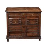 A CHARLES II OAK CHEST OF DRAWERS