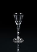 A LIGHT BALUSTER WINE GLASS OF NEWCASTLE TYPE