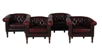 A SET OF FOUR BURGUNDY LEATHER UPHOLSTERED ARMCHAIRS