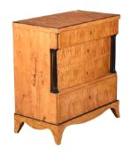 A BIEDERMEIER SATIN BIRCH AND PARCEL EBONISED CHEST OF DRAWERS