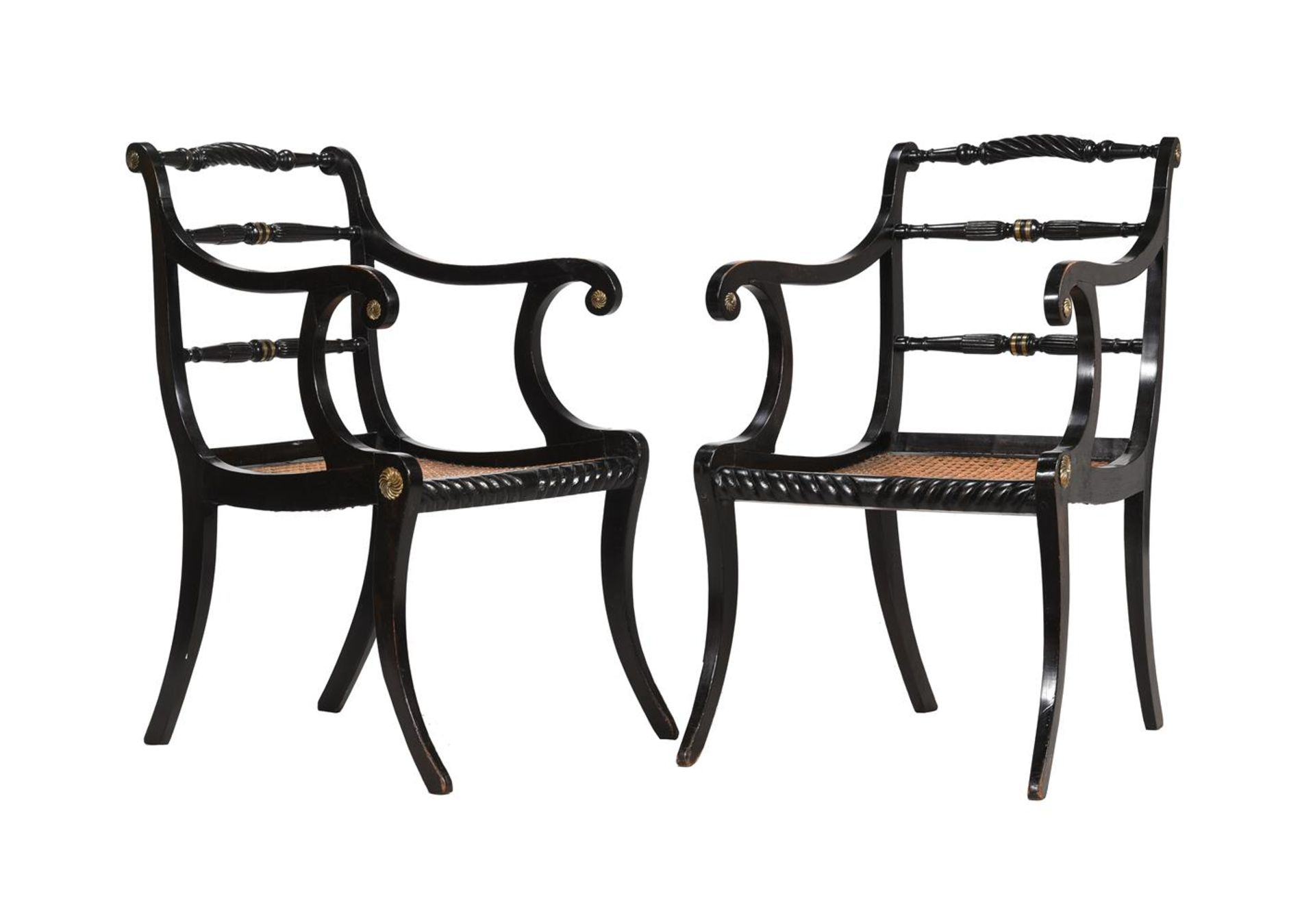 A PAIR OF REGENCY EBONISED AND BRASS INLAID ARMCHAIRS