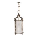 A PATINATED BRASS AND FROSTED GLASS HANGING LANTERN