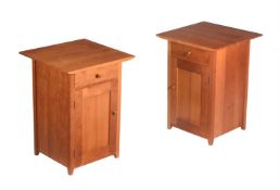 A PAIR OF CHERRY BEDSIDE CUPBOARDS