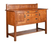 AFTER GUSTAV STICKLEY, AN OAK SIDEBOARD IN ARTS AND CRAFTS STYLE