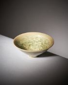 A rare small Chinese 'Yaozhou' celadon 'fish' conical bowl