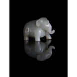 A Chinese pale celadon and russet jade Elephant