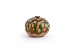 An attractive small Chinese sancia-glazed jar and cover