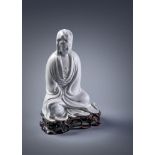 A rare Chinese Dehua model of seated Guanyin