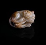 A Chinese white and russet jade lion