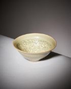 A small Chinese 'Yaozhou' celadon glazed 'chrysanthemum' bowl