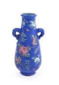 A Chinese yixing enamelled twin handled vase