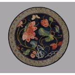 A Chinese embroidered silk roundel