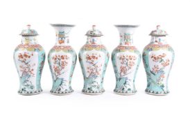 A Chinese garniture of five large Famille Verte vases