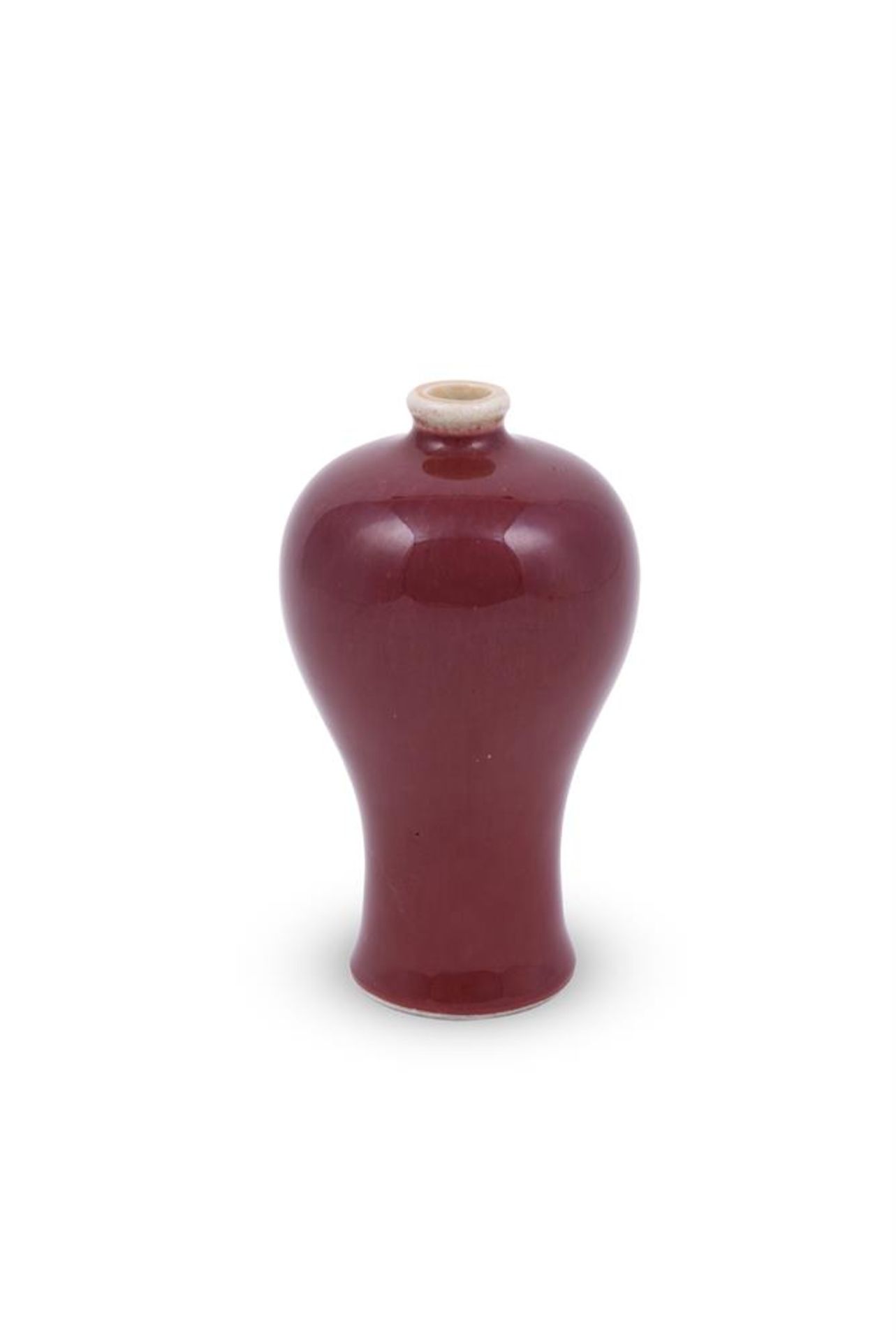 A small Chinese flambé red glazed vase