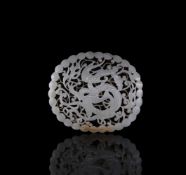 A Chinese pale celadon jade reticulated 'Dragon' plaque