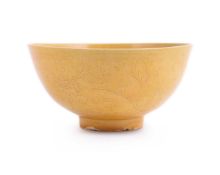 A Chinese porcelain yellow-glazed and incised bowl