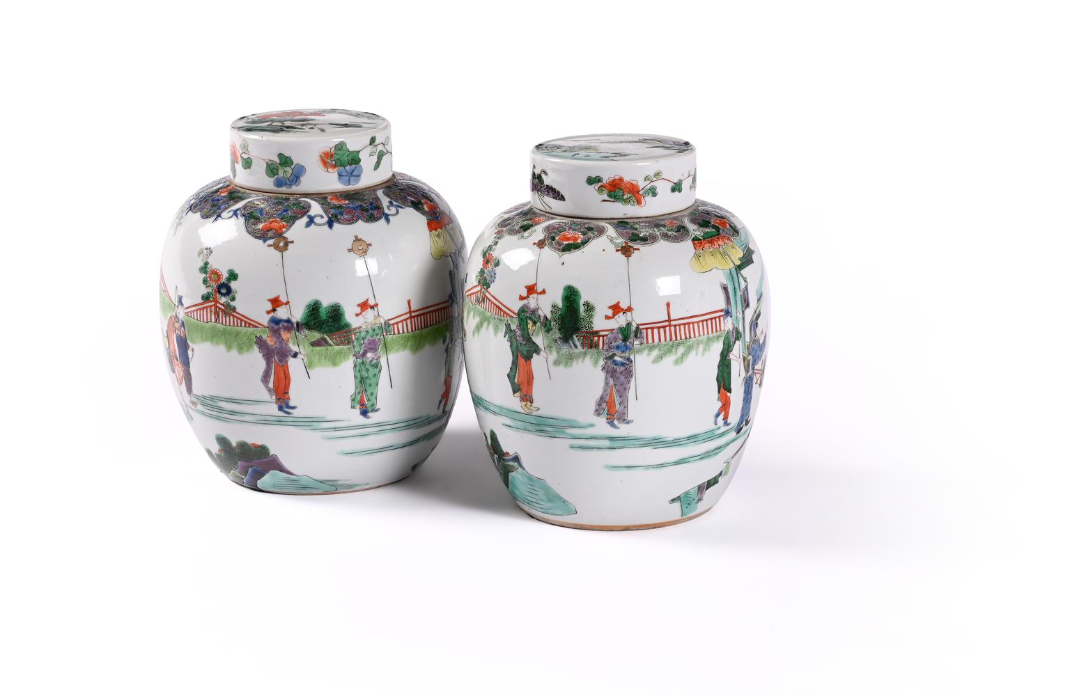 A pair of Chinese famille verte jars and covers