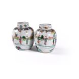 A pair of Chinese famille verte jars and covers