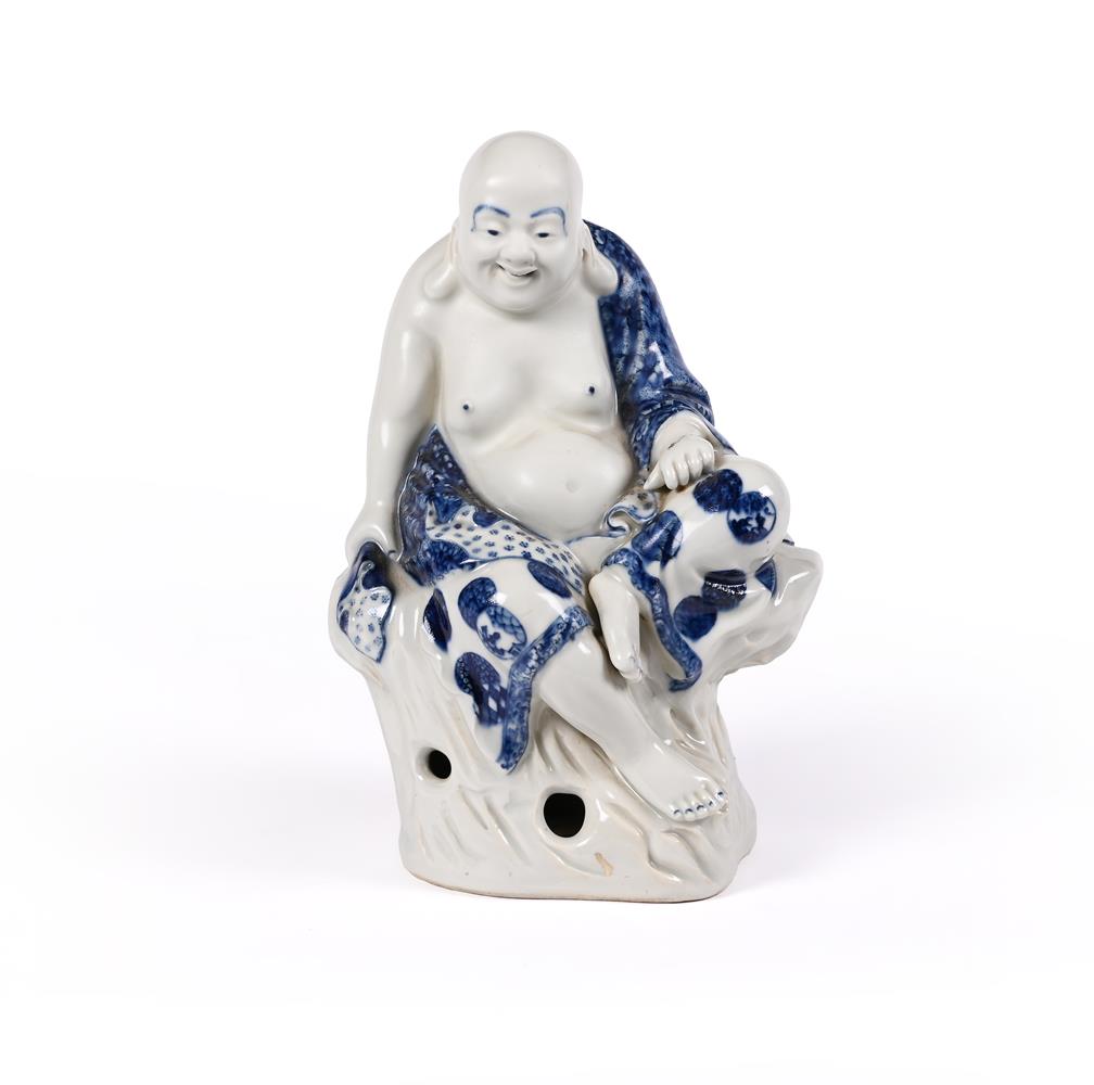 A Chinese blue and white figure of a seated Luohan