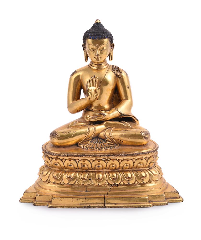 A Chinese seated gilt bronze figure of buddha