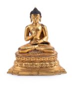 A Chinese seated gilt bronze figure of buddha