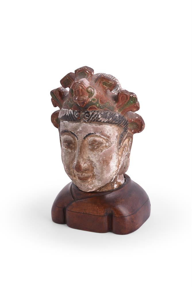 † A Chinese painted terra cotta head of bodhisattva