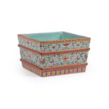 A Chinese turquoise-ground square jardinière or small ice-chest