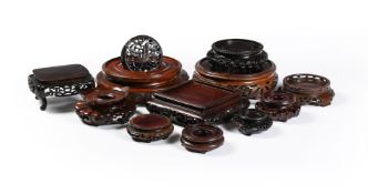A group of eleven Chinese wood stands