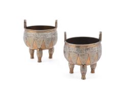 A pair of Chinese bronze tripod censers