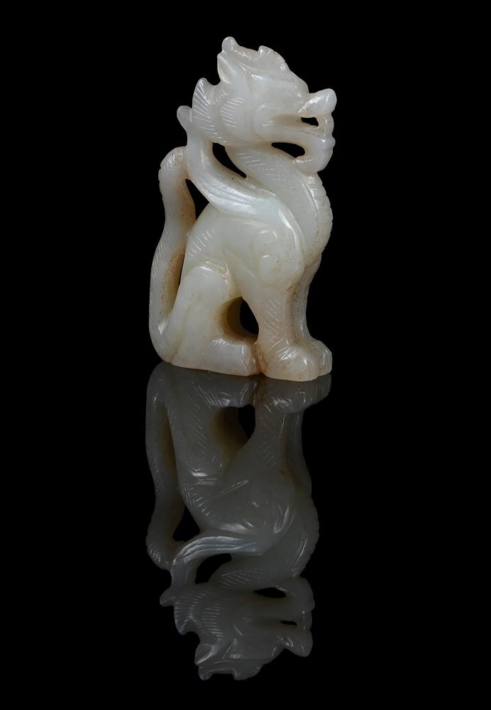 A small Chinese pale celadon jade carving of 'Dragon'