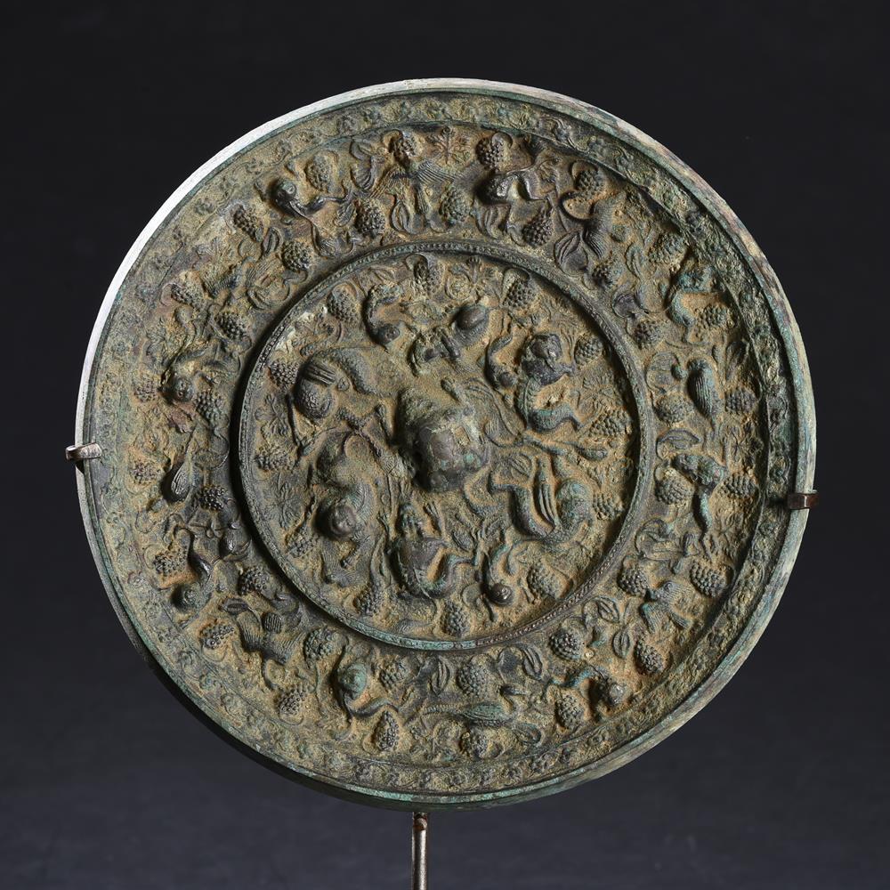 A large Chinese bronze 'Mythical Animals and Grapes' mirror - Image 2 of 3