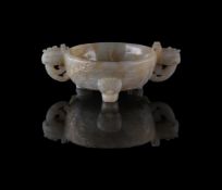 A Chinese pale celadon jade twin handled tripod censer