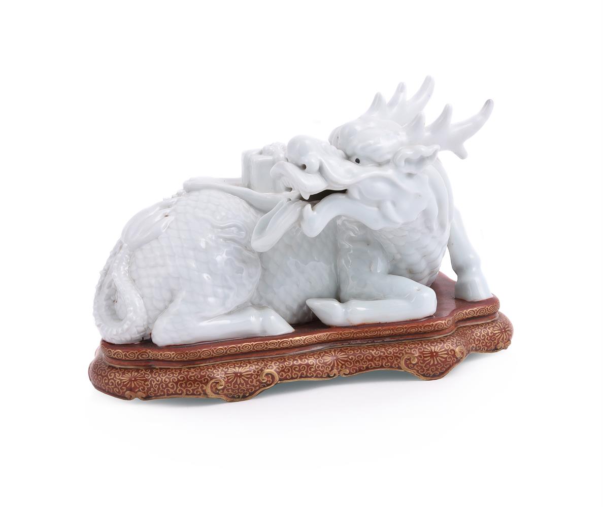 A Chinese white glazed and Famille Rose porcelain group of a qilin