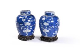 A pair of Chinese blue and white 'prunus' ginger jars and covers