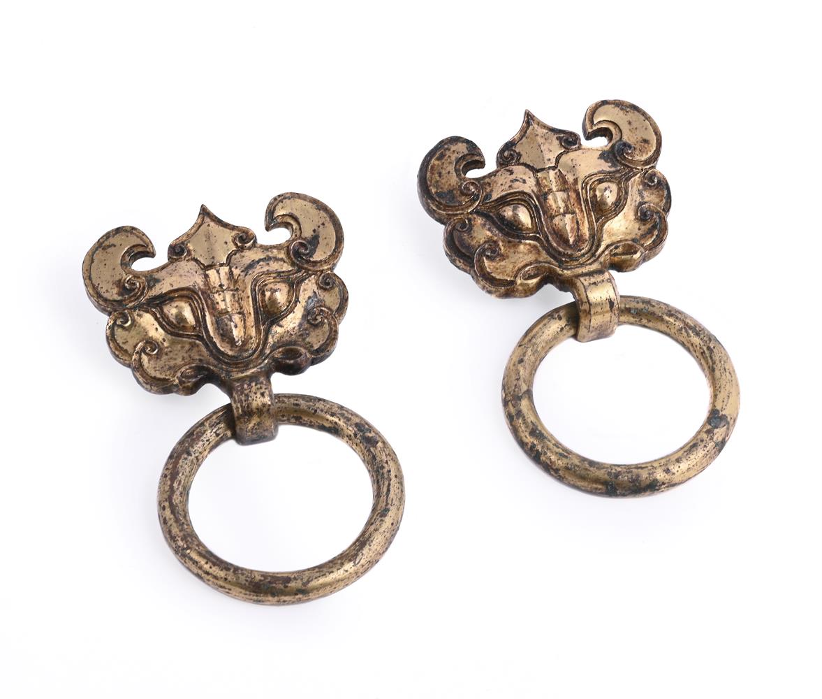 A pair of Chinese gilt bronze taotie handles with suspending rings