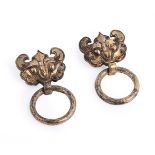 A pair of Chinese gilt bronze taotie handles with suspending rings