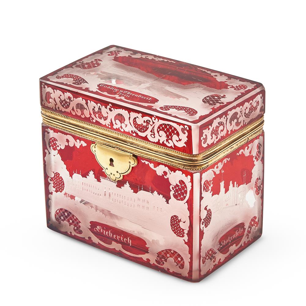 A BOHEMIAN RUBY FLASHED AND ENGRAVED CLEAR GLASS AND GILT METAL MOUNTED SOUVENIR RECTANGULAR BOX