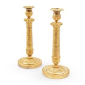 A PAIR OF FRENCH CHARLES X ORMOLU CANDLESTICKS, CIRCA 1830